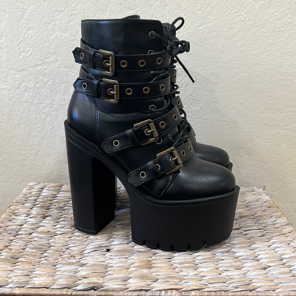 Black Platform boots with gold buckles